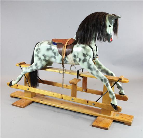 A dapple grey painted rocking horse, by Haddon Rockers, H.4ft 2in. L.5ft 10in.